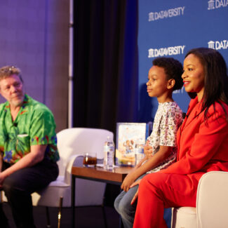 session speaker on stage with moderator