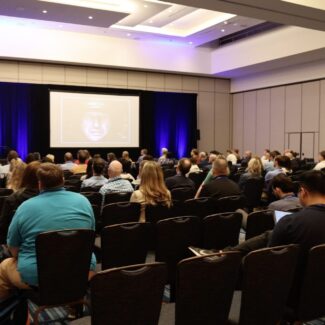 ongoing session with attendees in seats